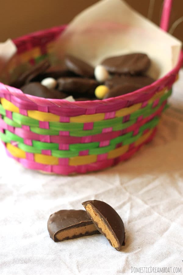 Homemade chocolate peanut butter eggs with a pink Easter basket.