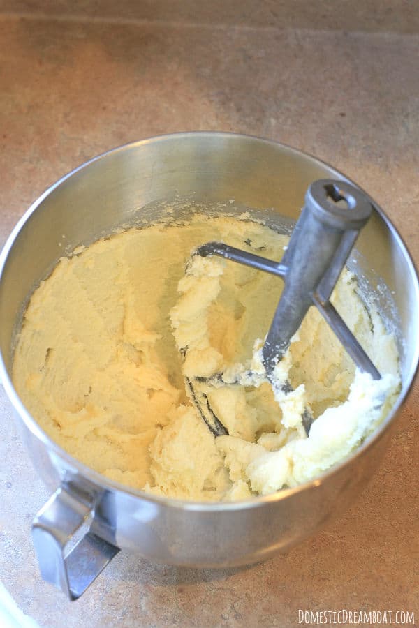 Creamed butter and sugar in a stainless steel mixing bowl.