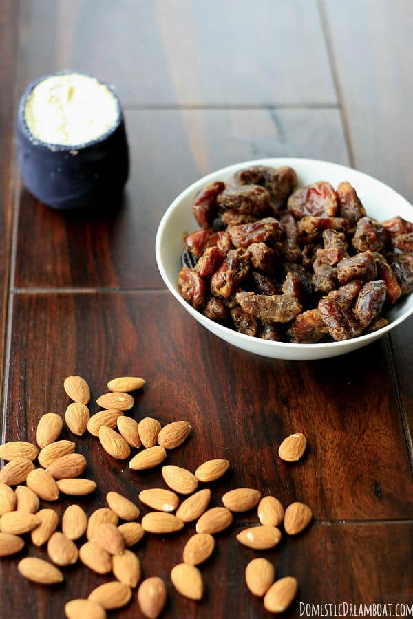 Ingredients to make bacon-wrapped stuffed dates: roasted almonds, dates, blue cheese.