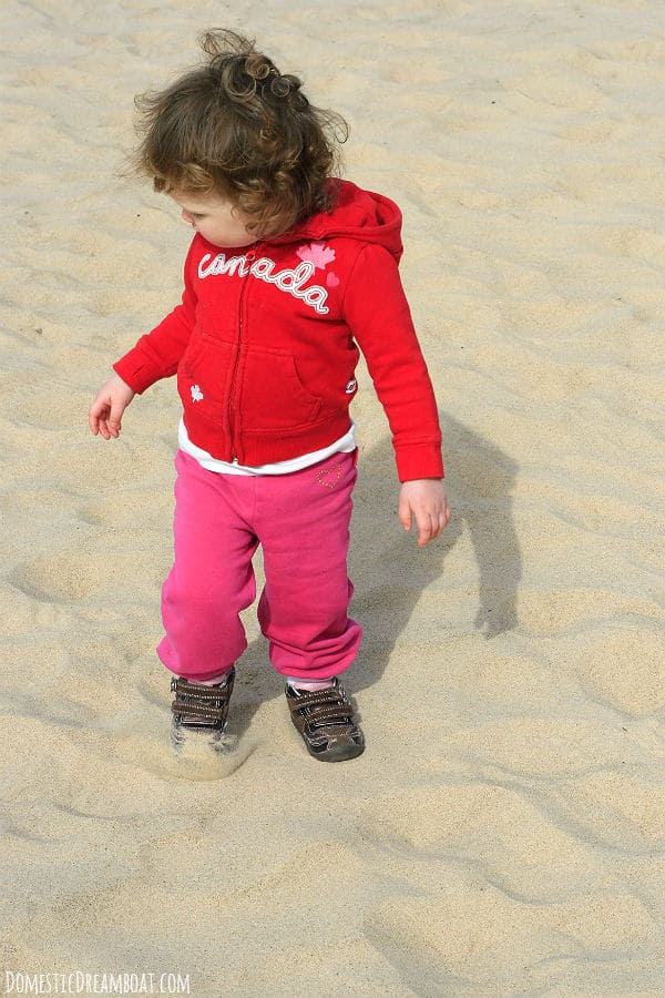 Playing in the sand on the shore of Lake Michigan