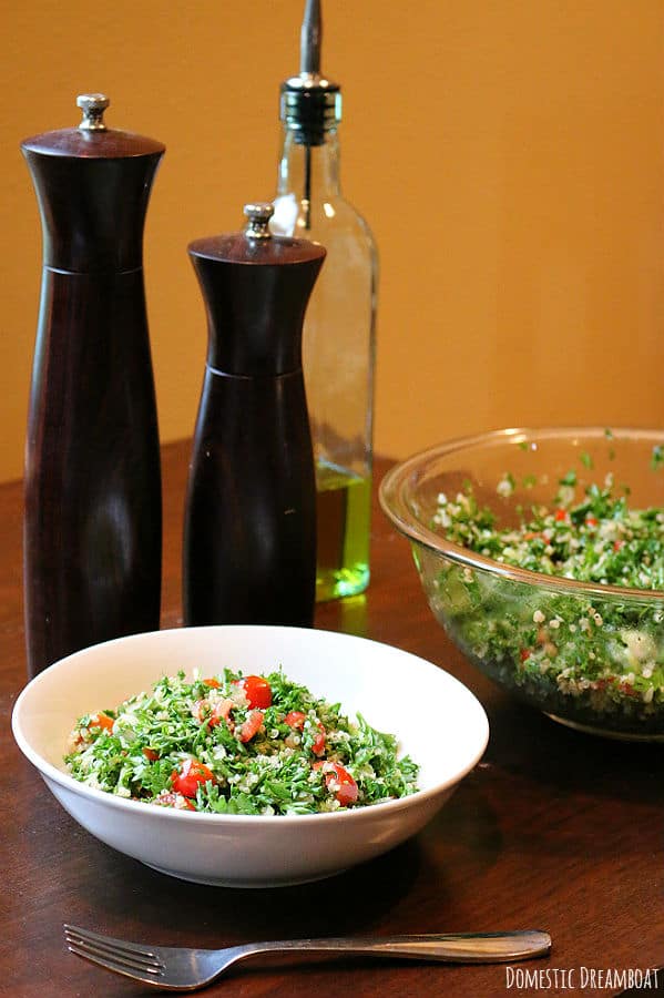 Quinoa Tabbouleh Salad in a white bowl.