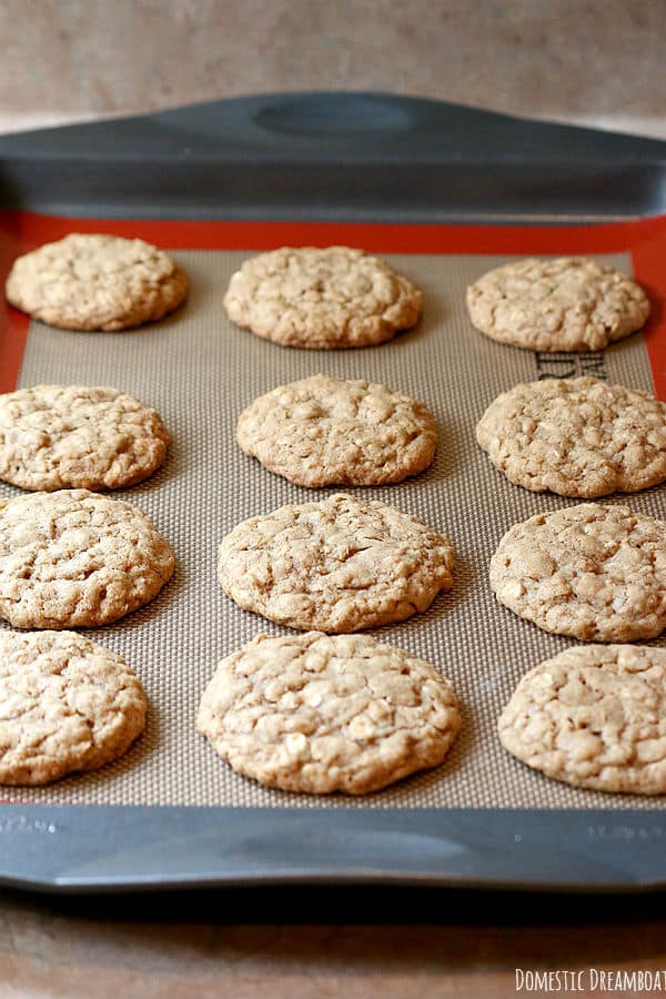 Homemade oatmeal cookies on a baking sheet.