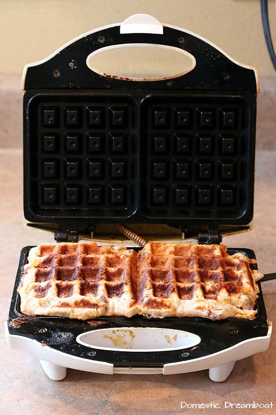 Finished sausage and cheese waffle in iron