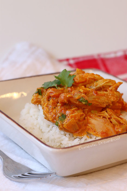 Quick and Easy Butter Chicken over rice in a bowl.