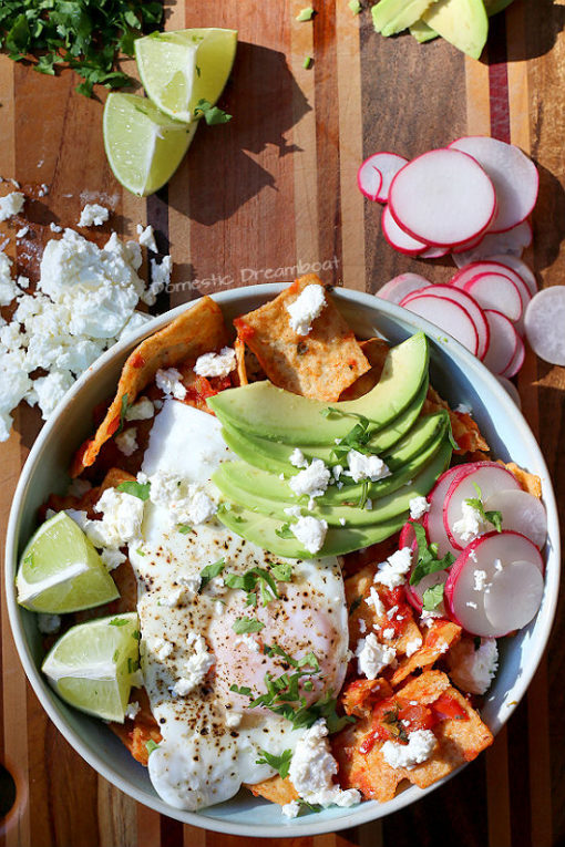 Overhead photo of quick and easy chilaquiles in a pale blue bowl.