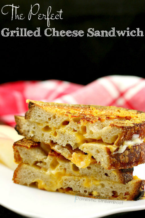 Head on photo of stacked grilled cheese sandwich halves with text title