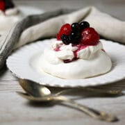 Mixed Berry Pavlova on a white plate.