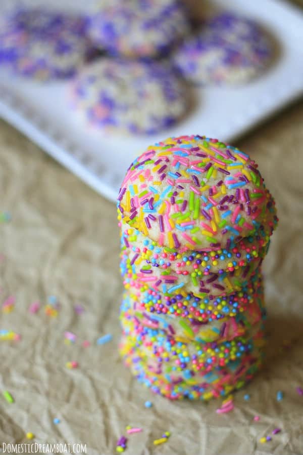 A stack of sprinkle covered sugar cookies