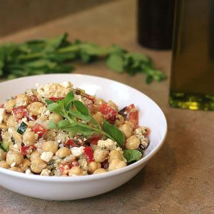 Chickpea and quinoa salad in a white bowl.