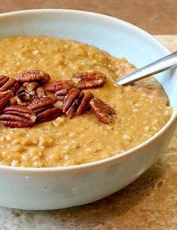 Pumpkin spice oatmeal garnished with pecans.