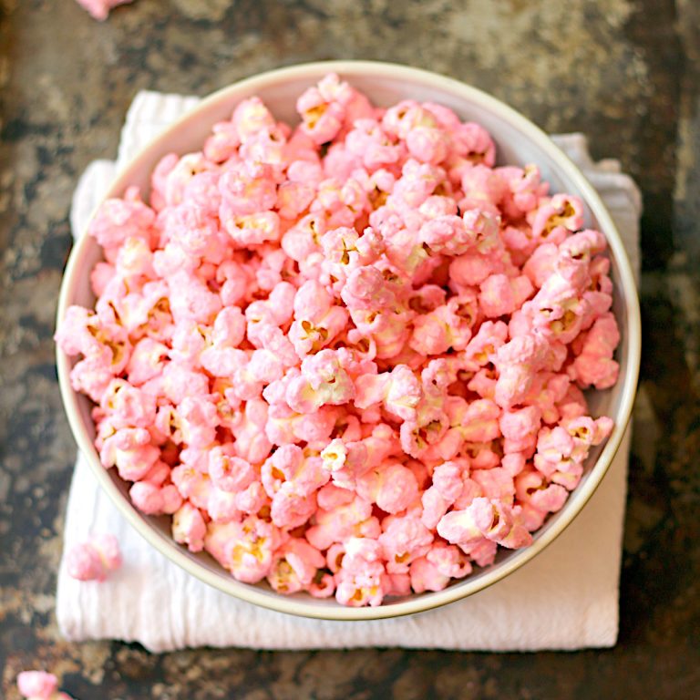 Overhead photo of pink popcorn in a bowl.