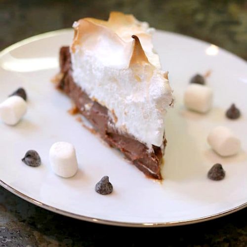 A slice of S'Mores Pie on a white plate.