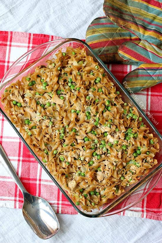 An overhead photo of salmon noodle casserole in a glass baking dish.