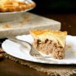 Slice of Tourtiere - French Canadian Meat Pie on a plate