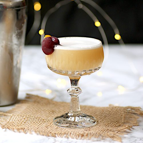 Amaretto sour cocktail in a crystal glass