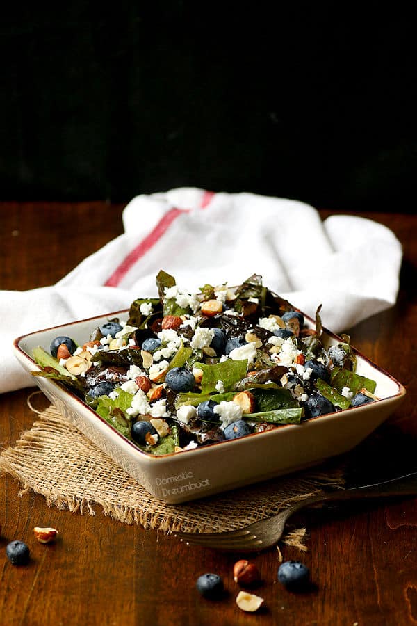 Photo of salad with blueberries, feta cheese, and hazelnuts in a bowl