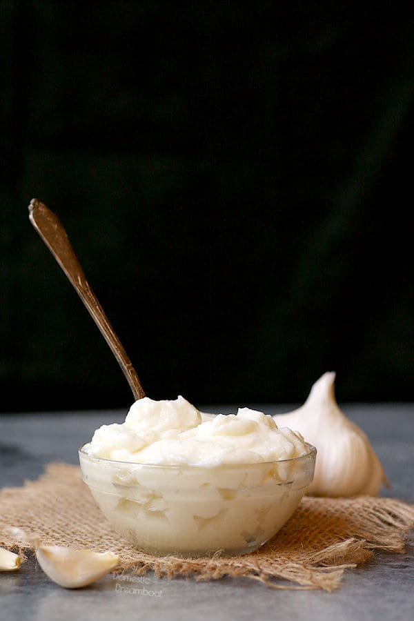 Lebanese Garlic Sauce in a bowl with a spoon