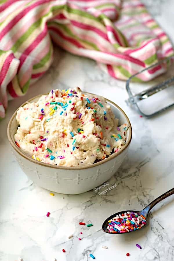 A bowl of cookie dough with sprinkles.