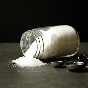 A jar of MSG-salt tipped on its side.