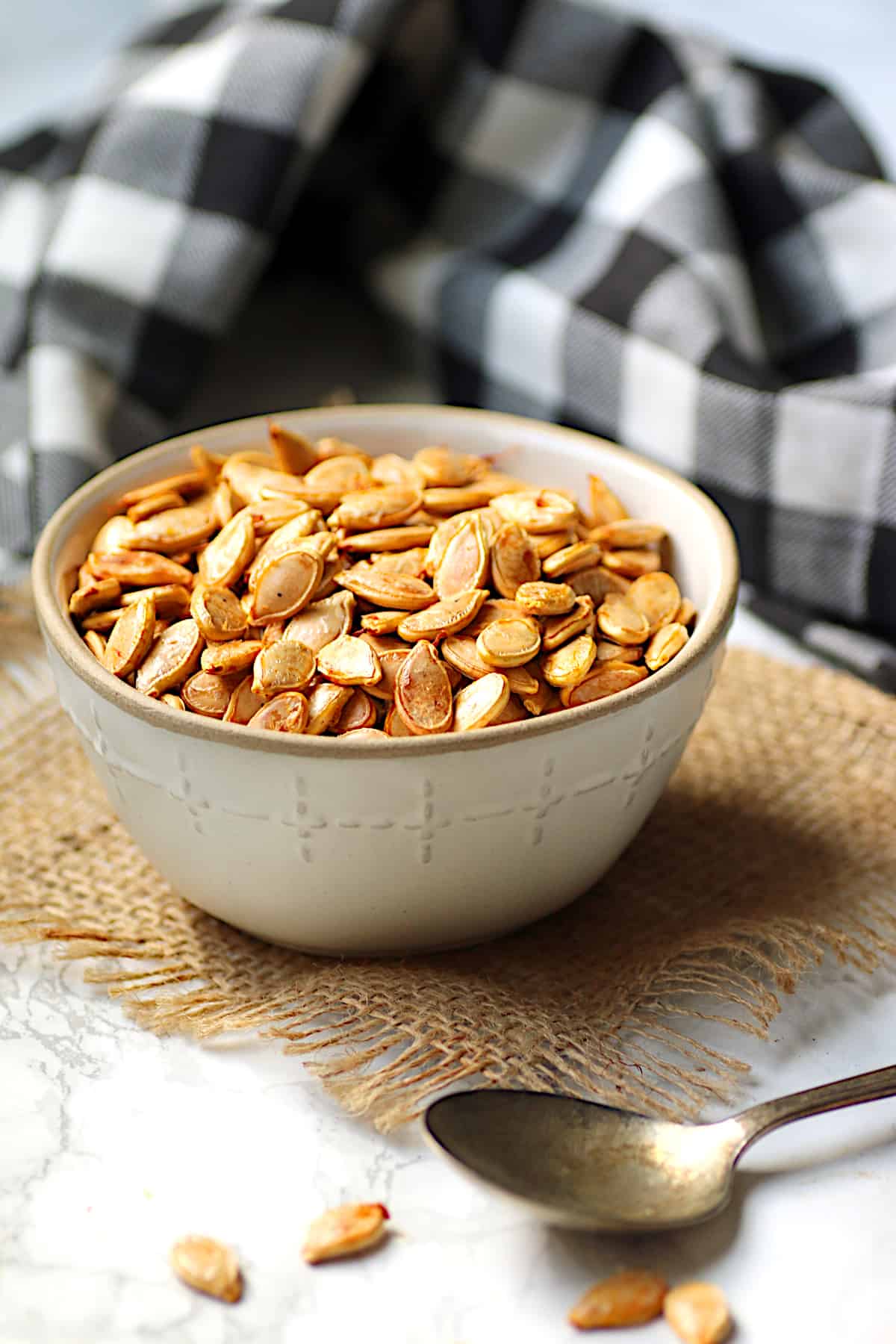 Homemade roasted pumpkin seeds in a bowl.