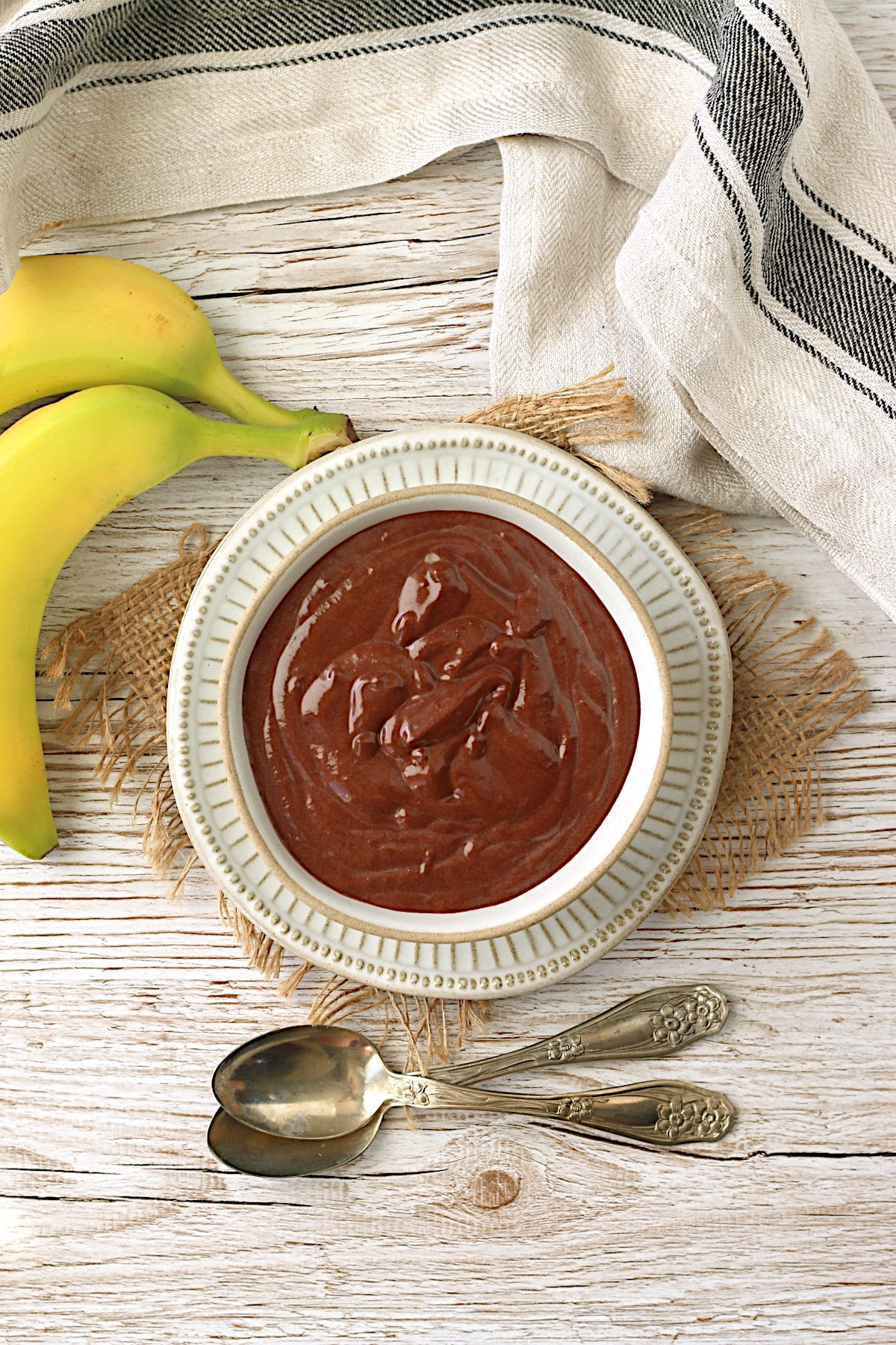An overhead photo of a bowl of vegan chocolate banana pudding.