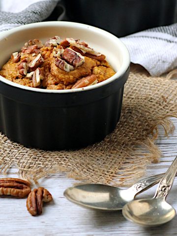 Pumpkin spice oatmeal garnished with pecans.