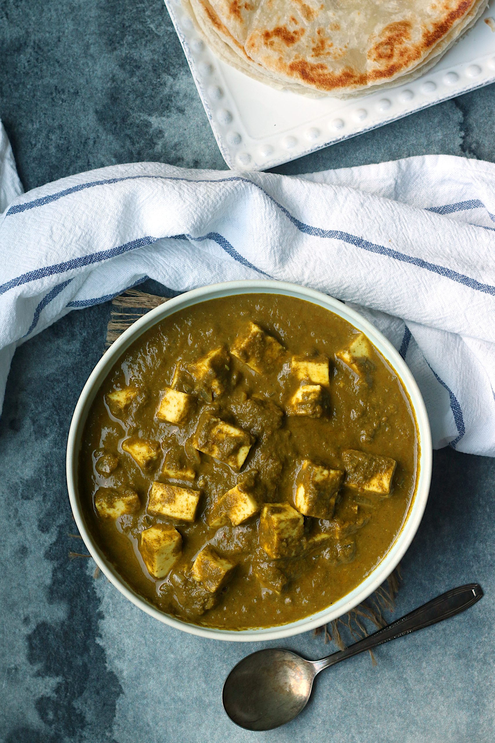An overhead photo of homemade palak paneer in a bowl.