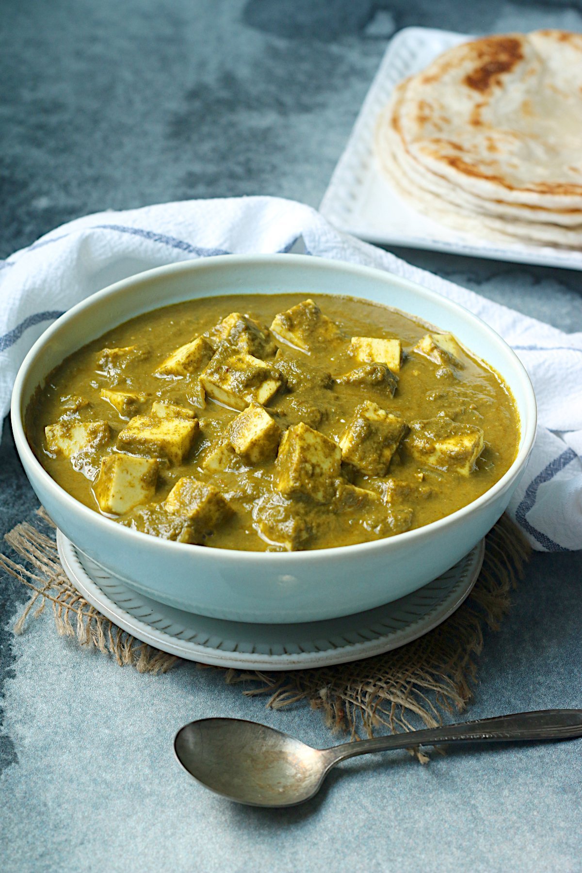 Homemade Palak Paneer in a pale blue bowl.