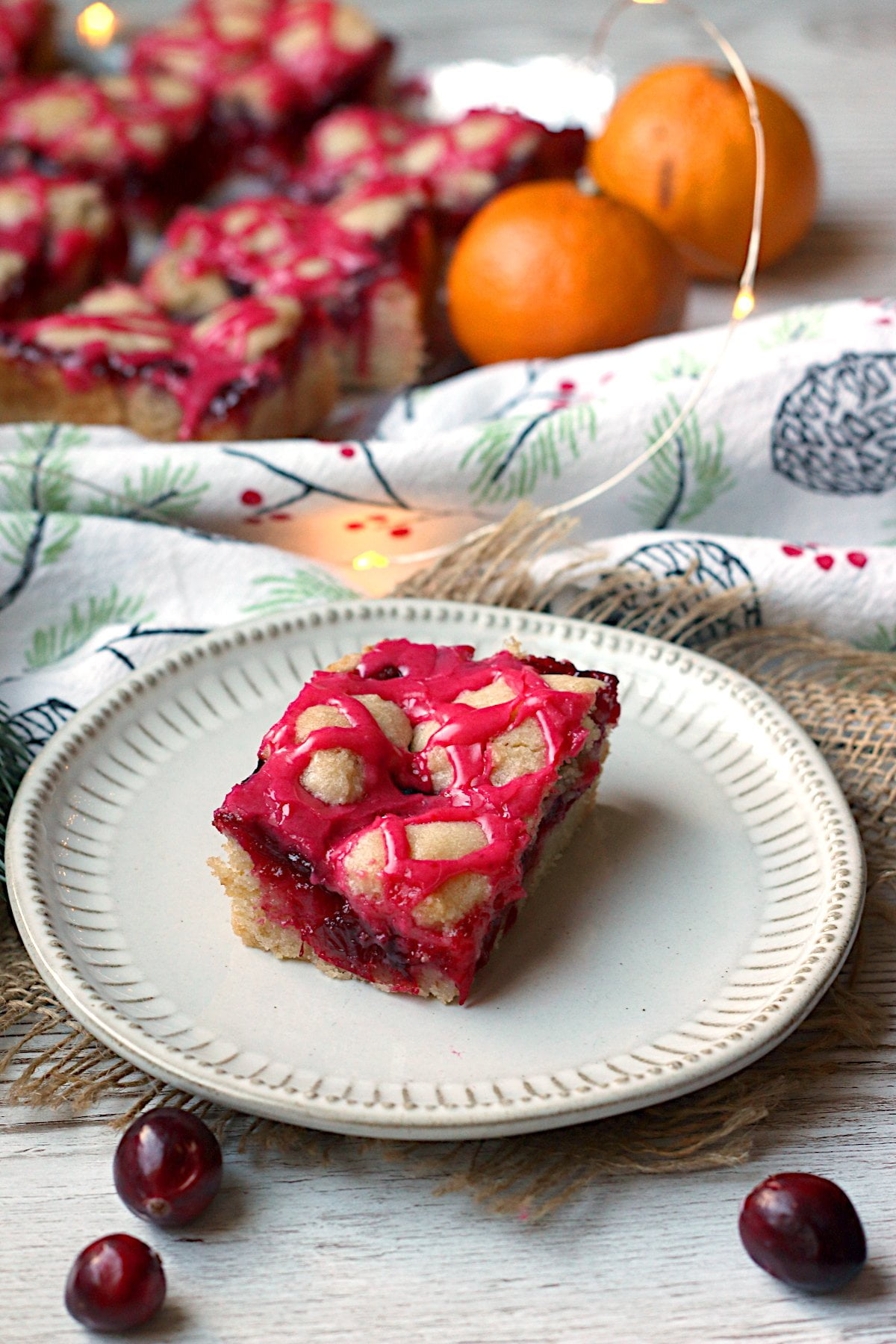 Cranberry pie bar on a small white plate.