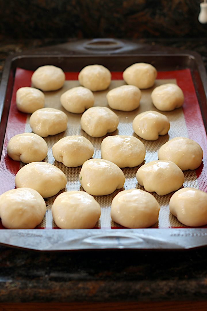 Ukrainian Perishky on a baking sheet before baking.