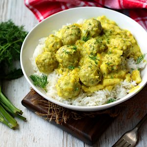 Turkey Meatballs in Curry Sauce in a white bowl.