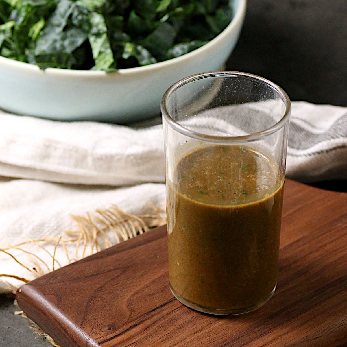 A glass jar of Basil Balsamic Vinaigrette.