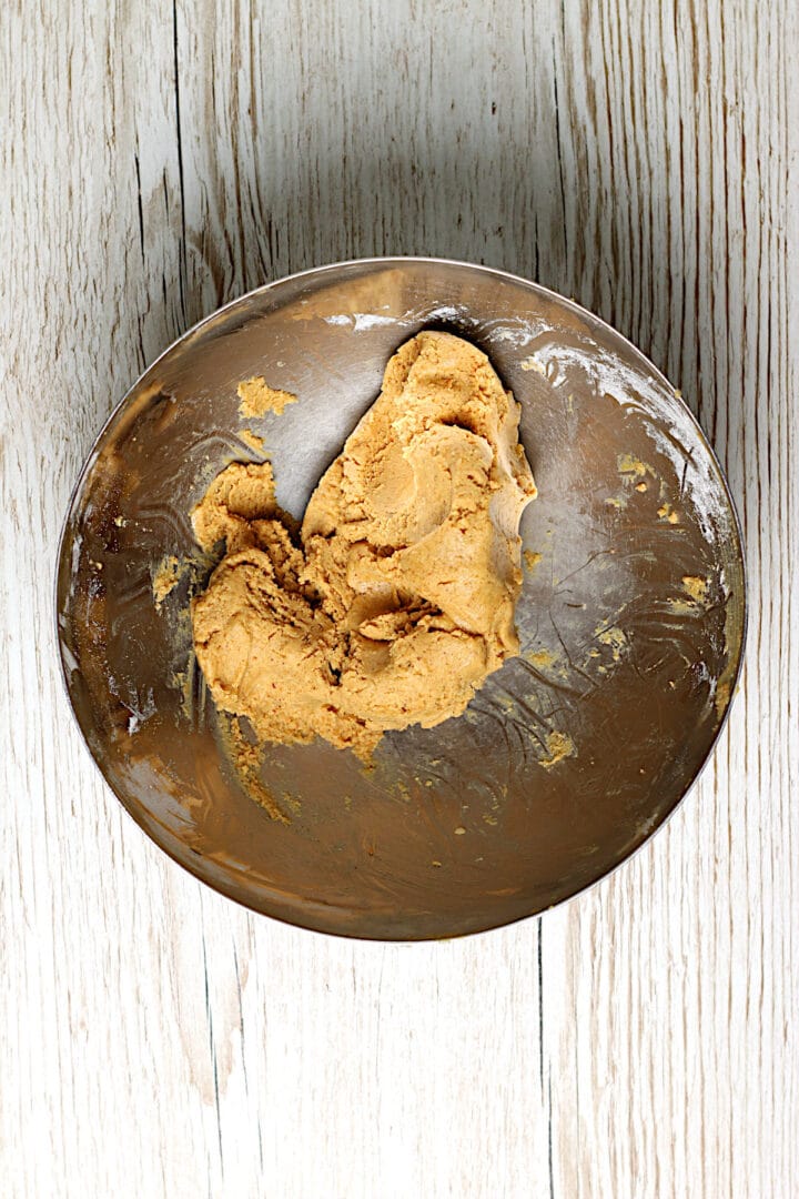Peanut butter candy filling in a stainless steel bowl.