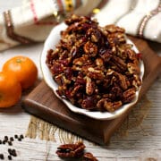 Cranberry Orange Candied Pecans in a white dish.
