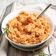 Mashed Potatoes and Carrots in a white bowl.