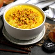 Burmese Coconut Chicken Noodle Soup in a white bowl.