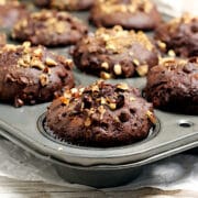 Chocolate Hazelnut Banana Muffins in a muffin pan.