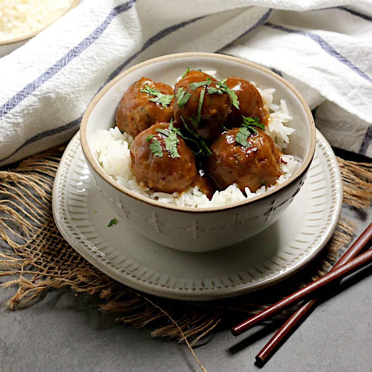Turkey Meatballs with Peanut Sauce Turkey Meatballs with Peanut Sauce in a small white bowl.