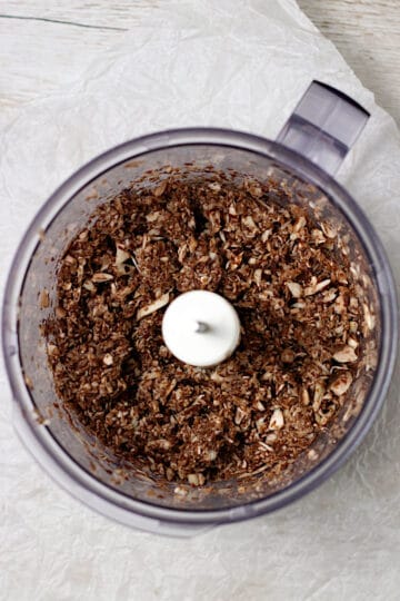 Chopped mushrooms in a food processor.