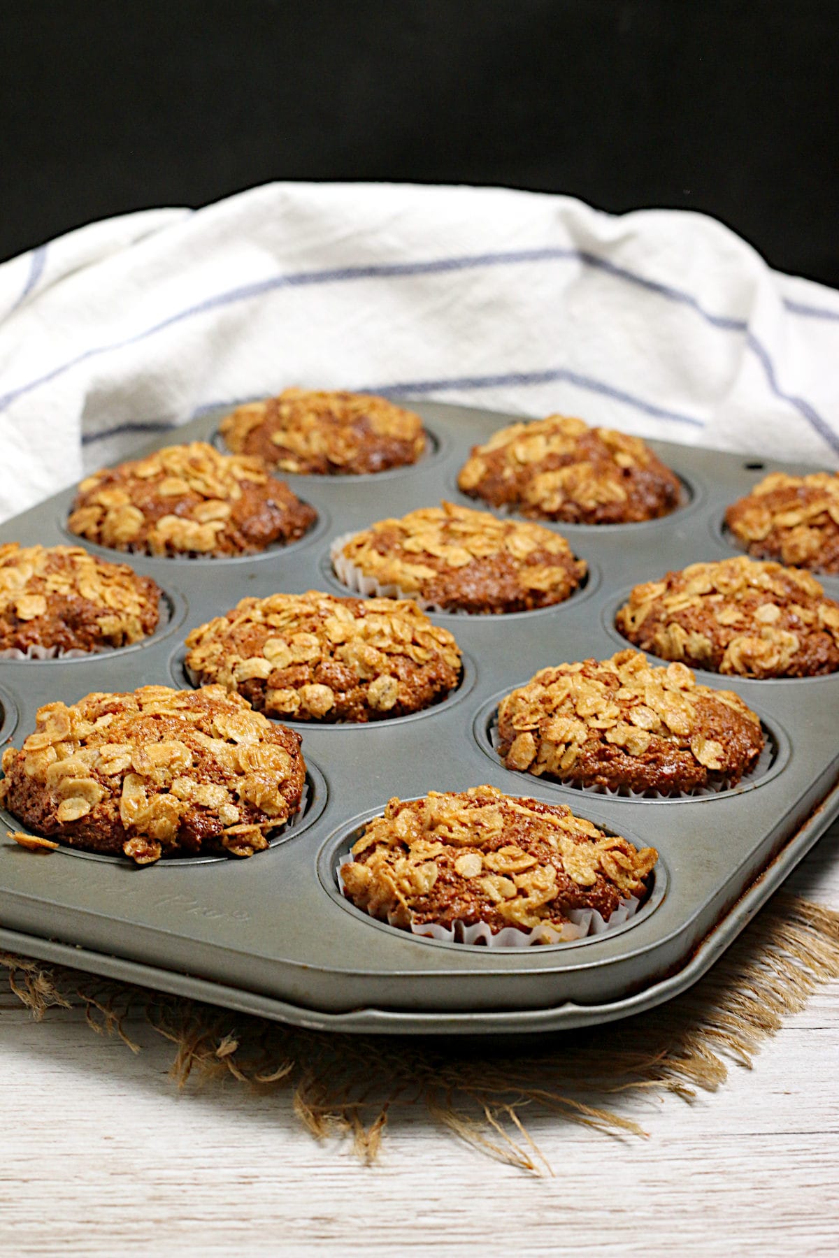 Maple and Brown Sugar Oatmeal Muffins A batch of homemade Maple and Brown Sugar Oatmeal Muffins in a muffin pan.