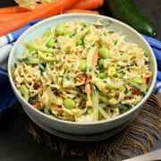 Noodle Salad with Tahini Dressing in a pale blue bowl.