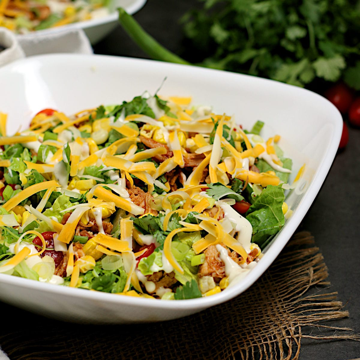 Barbecue Chicken Ranch Salad Barbecue Chicken Ranch Salad in a white bowl.
