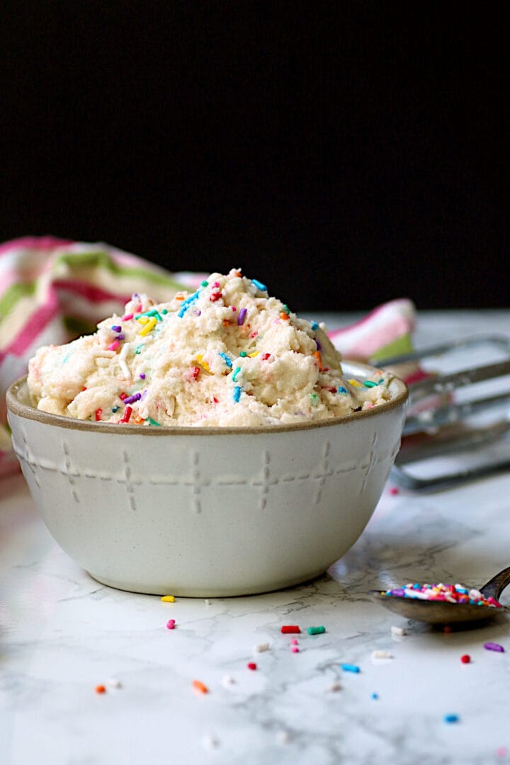 Edible Sugar Cookie Dough A bowl of edible sugar cookie dough with sprinkles.
