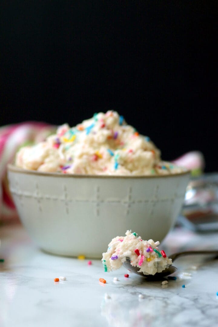 Edible Sugar Cookie Dough A bowl of edible sugar cookie dough with sprinkles.