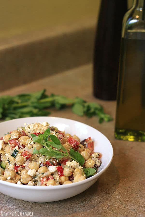 Chickpea and quinoa salad in a white bowl.