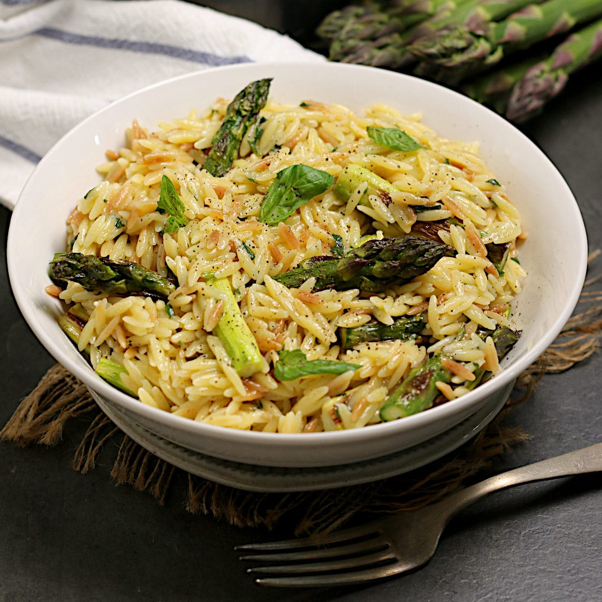 Parmesan Basil Orzo with Roasted Asparagus Parmesan Basil Orzo with Roasted Asparagus in a white bowl.