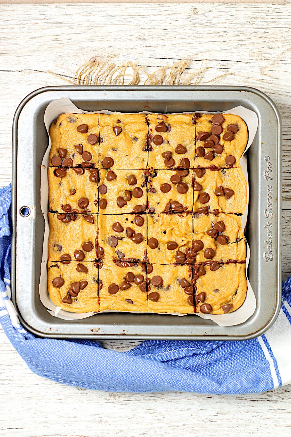 Flourless Chickpea Chocolate Chip Cookie Bars in a baking pan.