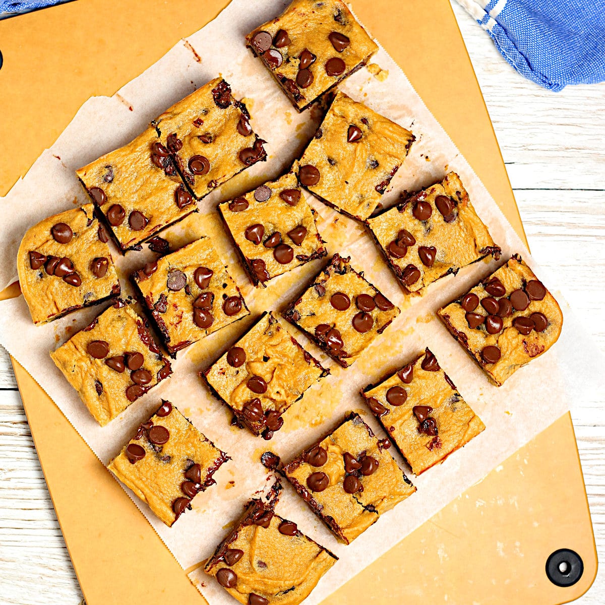 Overhead photo of Flourless Chickpea Chocolate Chip Cookie Bars on a cutting board.