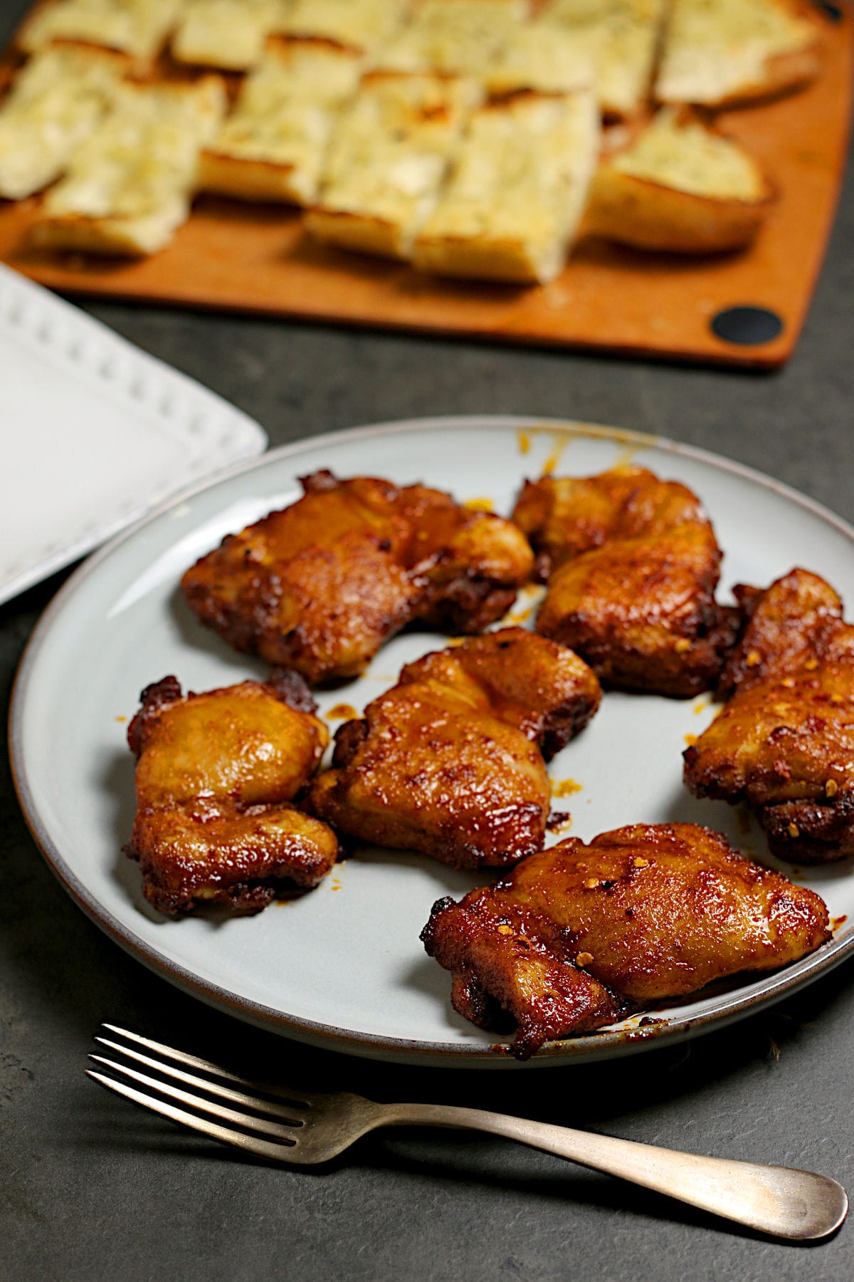 A platter of Hot Honey Glazed Chicken Thighs.