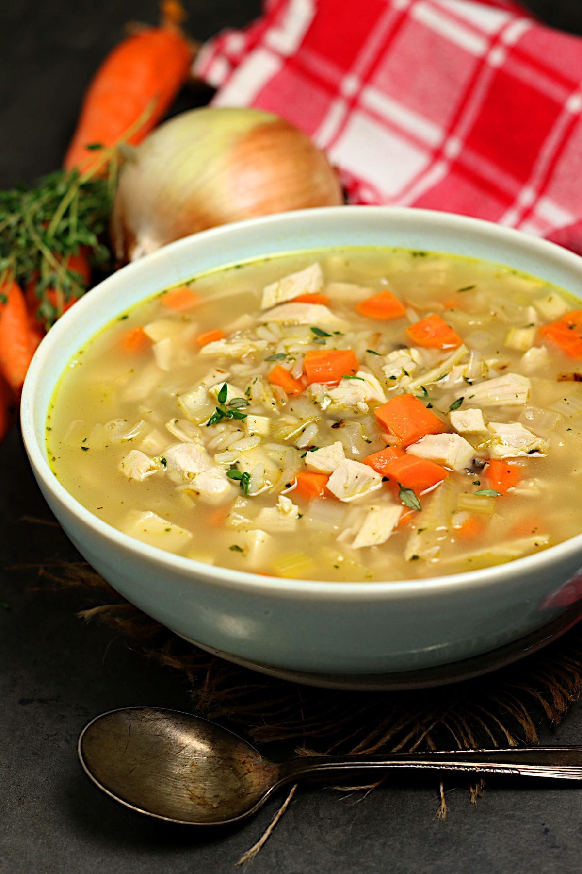 Homemade Turkey Rice Soup in a pale blue bowl.